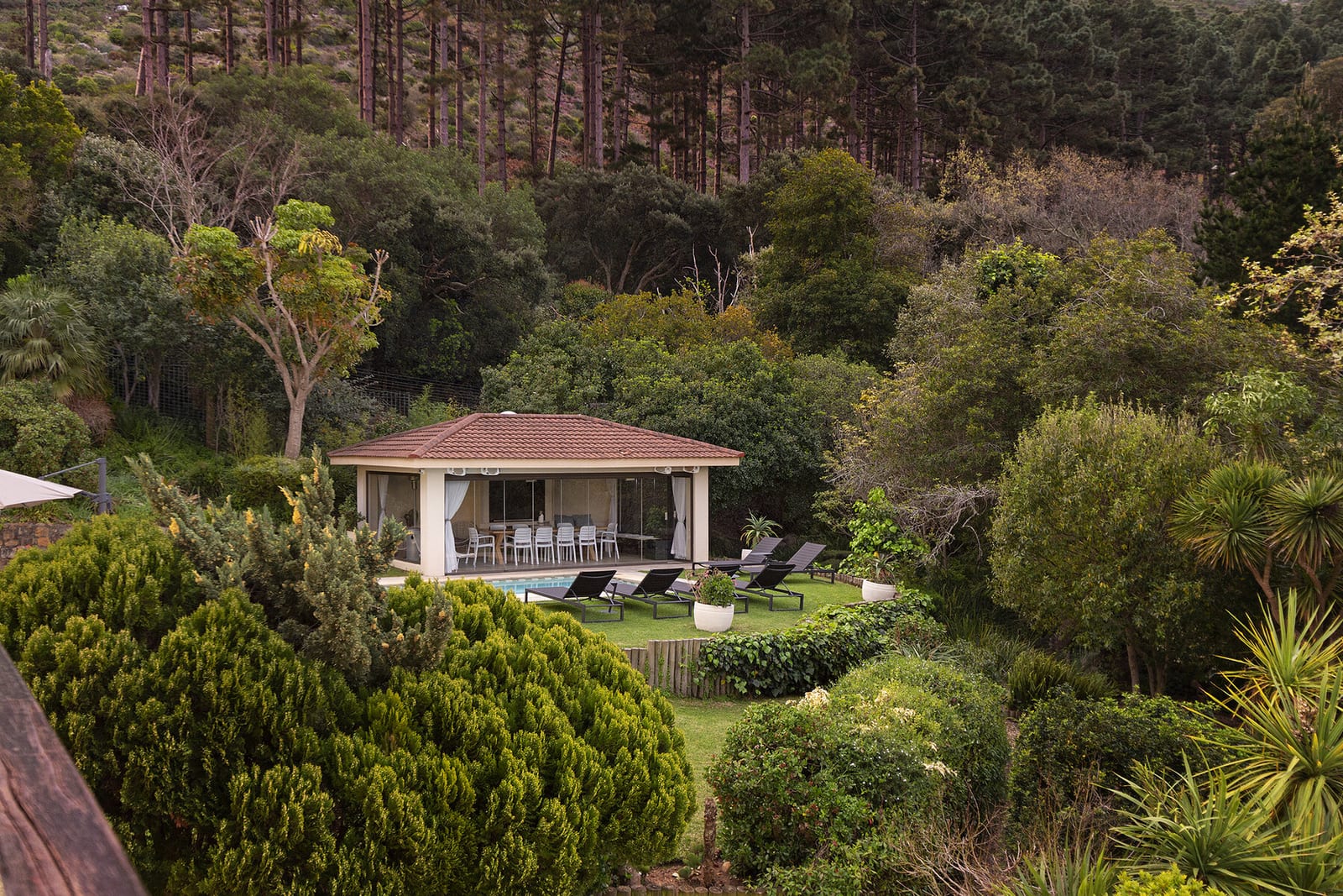 Green garden surrounding an outdoor pavilion
