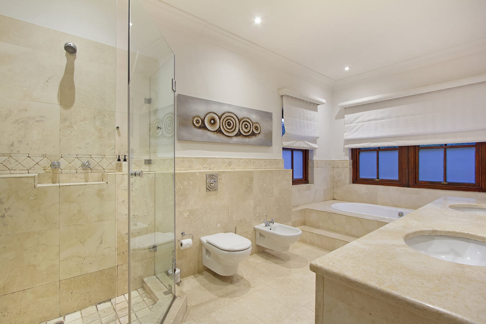 Bright bathroom with bath, shower and vanity